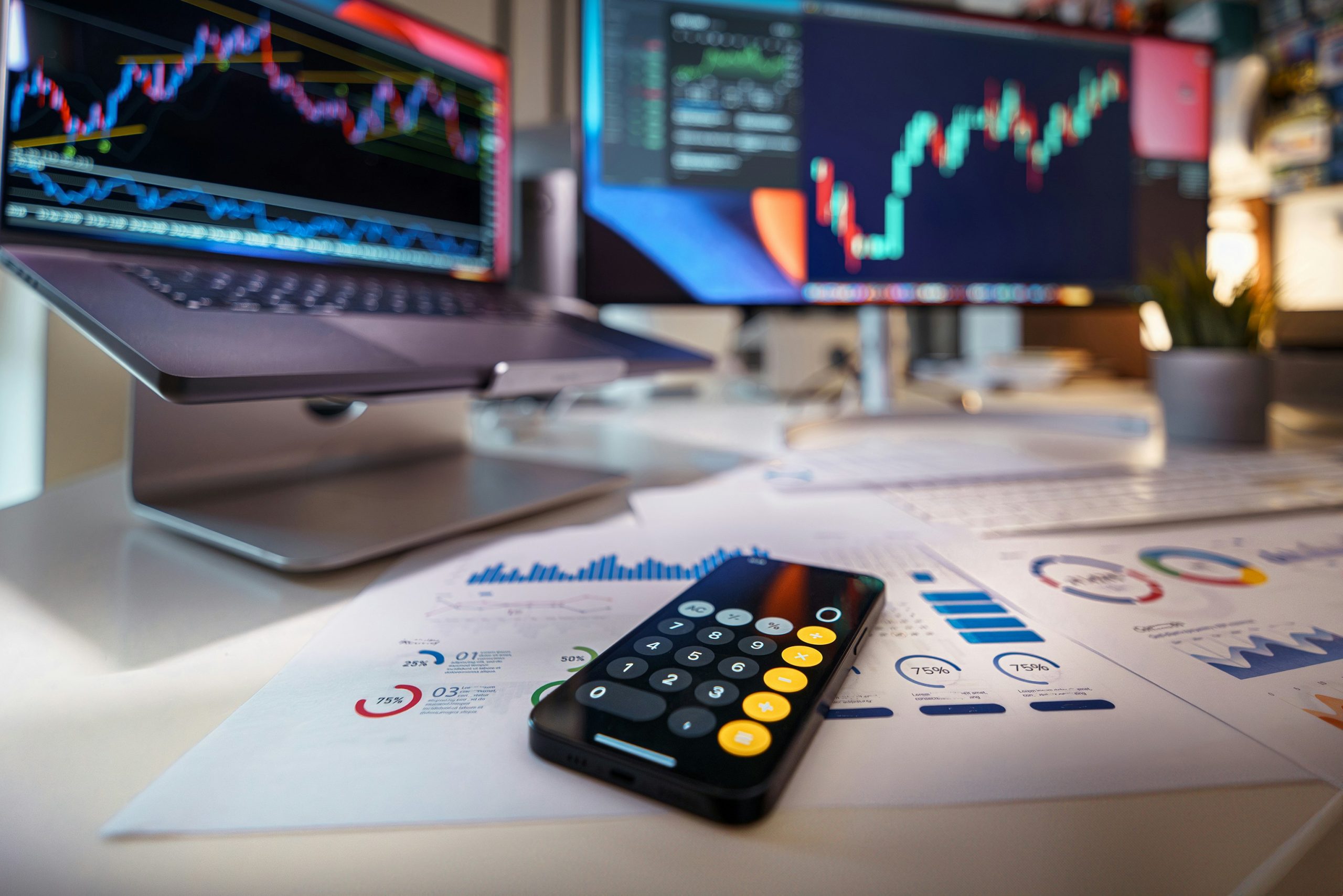 Financial market workstation with trading charts and analytical reports
