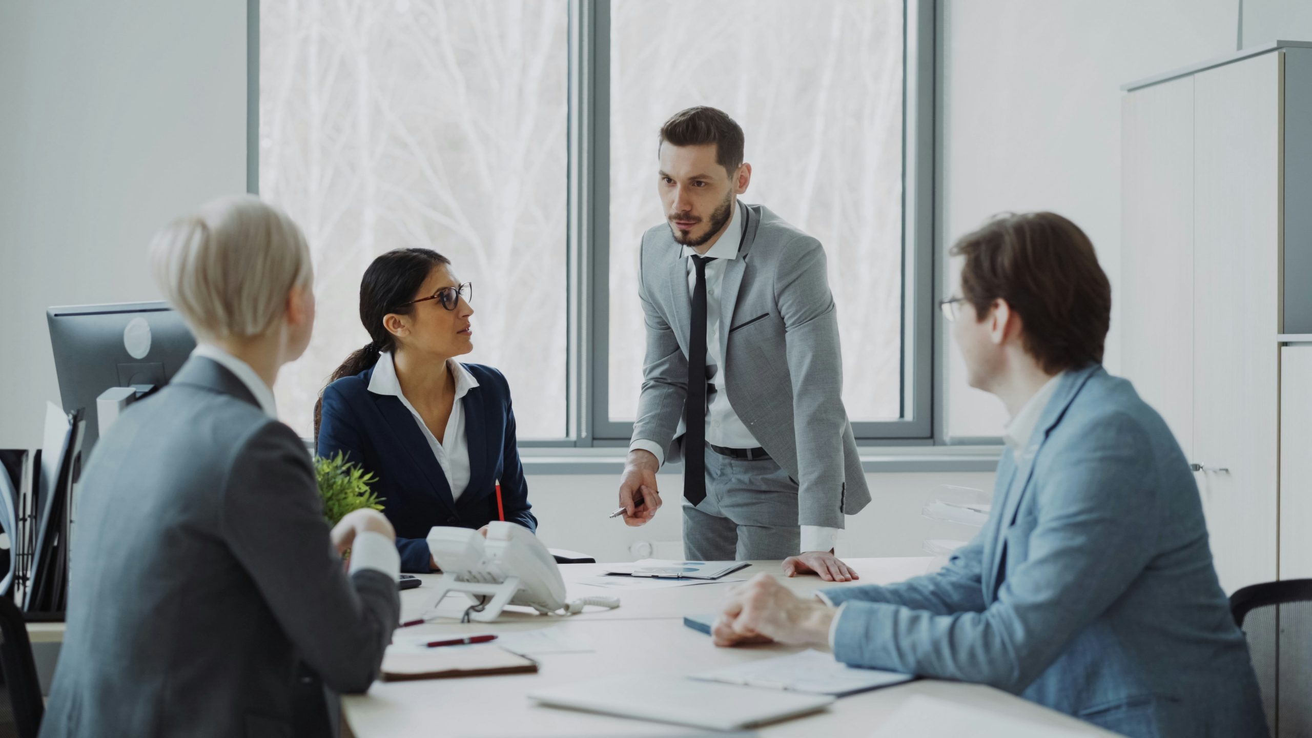 Senior professionals in a formal business meeting