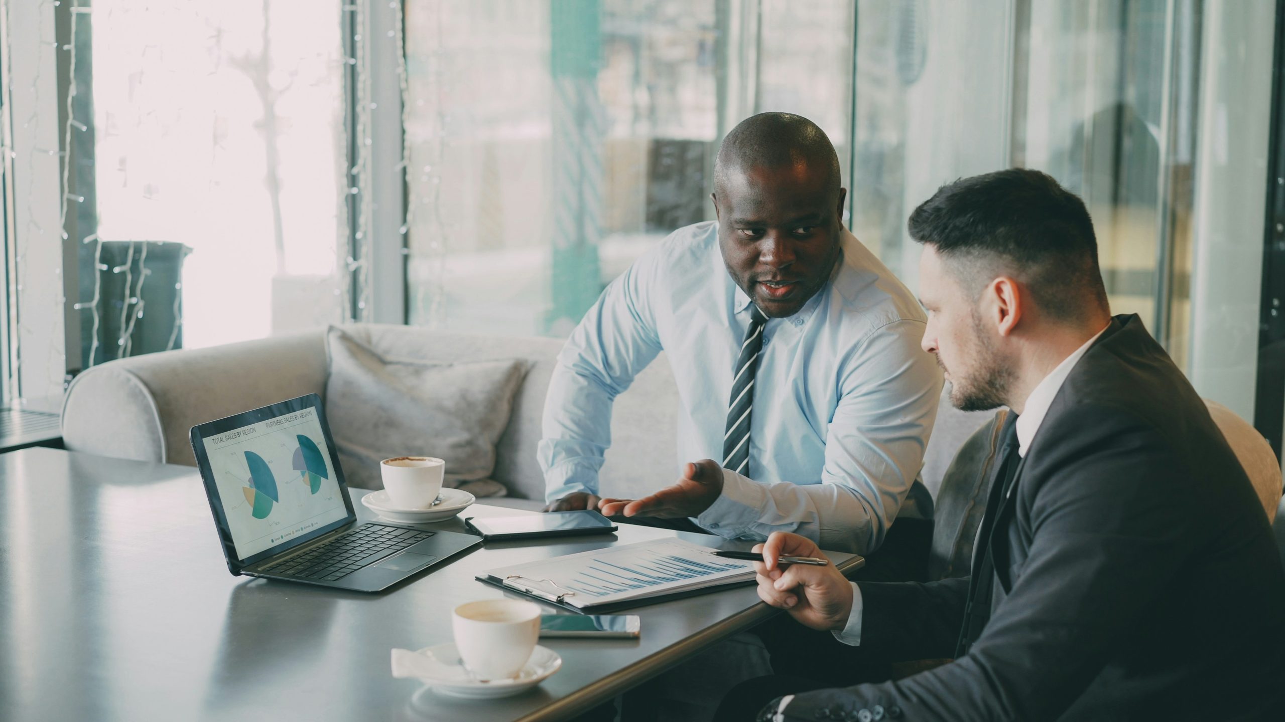 Investment professionals reviewing financial performance and strategy